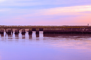 Sunset at the junction of River Blyth and Dunwich River in Southwold, a popular seaside town of the UK