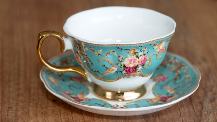 Porcelain tea and coffee cups on wood