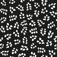 White Irregular vector dots randomly placed seamless pattern with black background.
