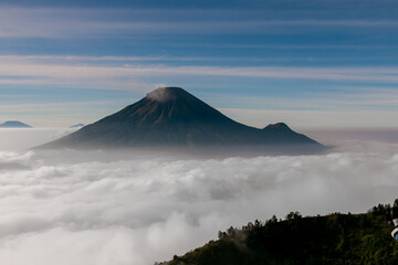 view of the sindoro mountains with a sea of ​​clouds