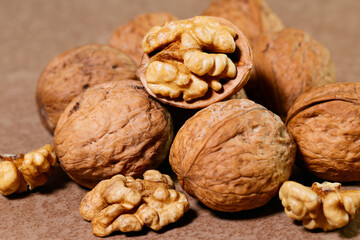 Food background. Walnut kernels close-up. Chopped nuts lie on a wooden table.