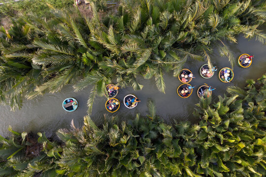 Aerial view, tourists in basket boats tour at the coconut water ( mangrove palm ) forest in Cam Thanh village, Hoi An, Quang Nam, Vietnam