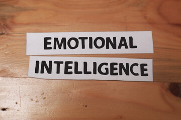 Emotional Intelligence, text words typography written on paper against wooden background, life and business motivational inspirational