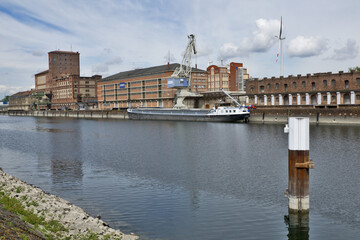 Karlsruhe, Germany: port of Karlsruhe with river rhine, ships, cranes and storage buildings