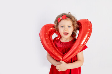 girl with heart, beautiful little girl holding big balloon heart