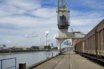 Karlsruhe, Germany: port of Karlsruhe with freight wagons, railway, crane, river  rhine ans storage...