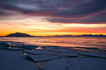 Fototapeta na wymiar Winter landscape sunset with broken piles of ice in Utah