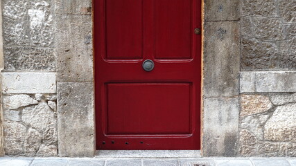 red door against stone background