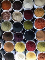 Top view on a assortment of various type of uncooked spice, beans, seeds, lentils, chickpeas