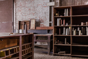Various wooden shelving units in an abandoned factory in the deep south