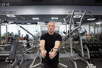 Man in the training gym  working hard after quarantine.