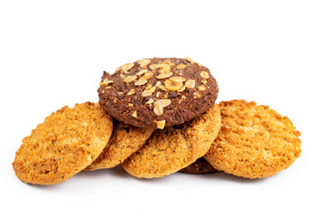 Homemade oatmeal and nut cookies isolated on white background.
