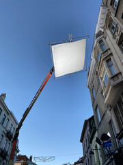 Shooting production, Process of filming. Spotlight illuminates large reflector