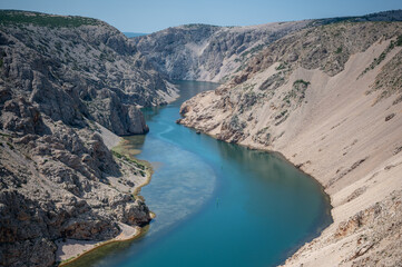 Obraz premium Woman enjoy the view - top of a mountain in Croatia - Landscape with blue river