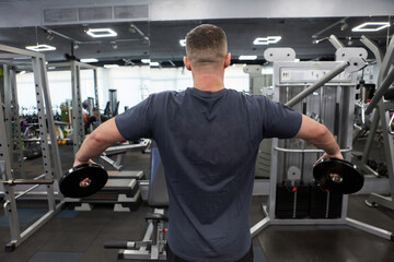 Man in the training gym  working hard after quarantine.