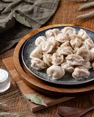 Homemade dumplings with sour cream