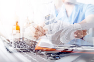 Medical technology concept The doctor works with mobile phones, headphones and tablets. Digital laptop in the modern office at the hospital in the morning	