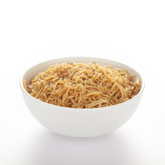 Indian spicy snacks (Namkeen) - Bikaneri Besan Bhujia in a white bowl, made with chickpea flour (Besan), side view, against the white background.
