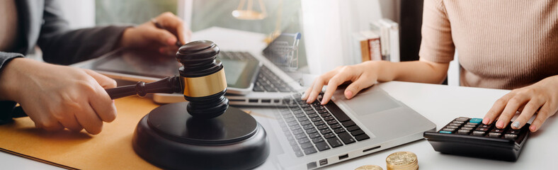 Business and lawyers discussing contract papers with brass scale on desk in office. Law, legal services, advice, justice and law concept picture with film grain effect	