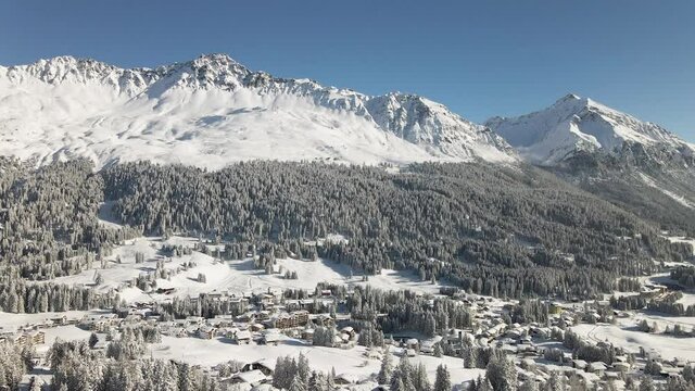 Snow covered village and mountains