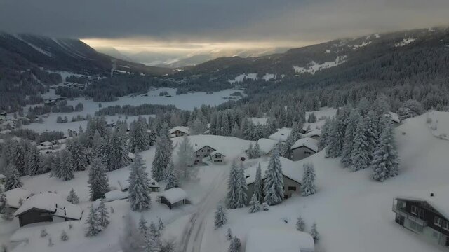 Snow covered village and mountains