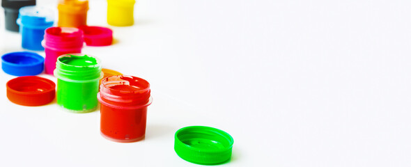 Gouache Paint cans on a white background. copy space
