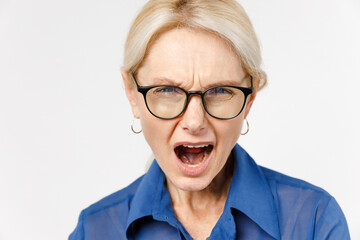 Close up blonde indignant angry displeased employee business woman 40s wearing blue classic shirt...