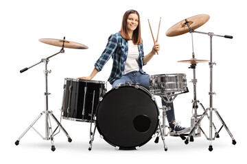 Obraz na płótnie Canvas Female drummer with a drum set