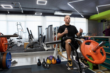 Man in the training gym  working hard after quarantine.