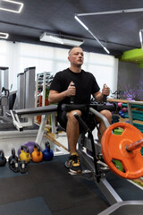 Man in the training gym  working hard after quarantine.