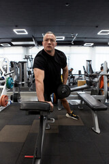 Man in the training gym  working hard after quarantine.