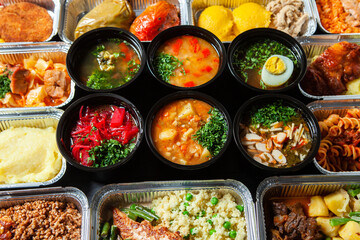 Business lunch in eco plastic container ready for delivery.Top view. Office Lunch boxes with food ready to go. Food takes away. Catering, brakfast