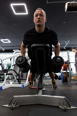 Man in the training gym  working hard after quarantine.
