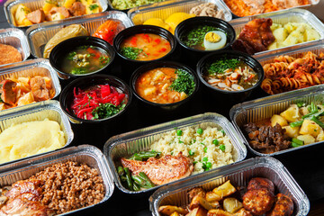 Business lunch in eco plastic container ready for delivery.Top view. Office Lunch boxes with food ready to go. Food takes away. Catering, brakfast