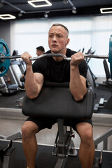 Man in the training gym  working hard after quarantine.