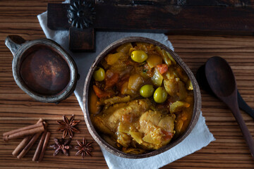 Traditional tagine plate with chicken, lemon and olive