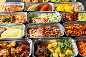 Business lunch in eco plastic container ready for delivery.Top view. Office Lunch boxes with food ready to go. Food takes away. Catering, brakfast
