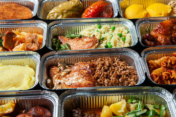 Business lunch in eco plastic container ready for delivery.Top view. Office Lunch boxes with food ready to go. Food takes away. Catering, brakfast