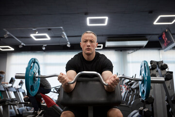 Man in the training gym  working hard after quarantine.