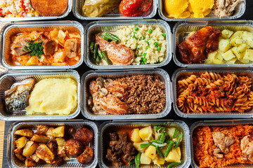 Business lunch in eco plastic container ready for delivery.Top view. Office Lunch boxes with food ready to go. Food takes away. Catering, brakfast.