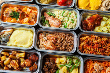 Business lunch in eco plastic container ready for delivery.Top view. Office Lunch boxes with food ready to go. Food takes away. Catering, brakfast.