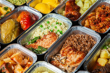 Business lunch in eco plastic container ready for delivery.Top view. Office Lunch boxes with food ready to go. Food takes away. Catering, brakfast.