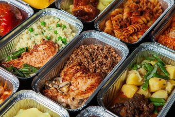 Business lunch in eco plastic container ready for delivery.Top view. Office Lunch boxes with food ready to go. Food takes away. Catering, brakfast.