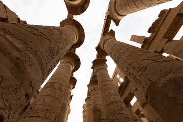 Karnak Temple Complex in Luxor Egypt. Central columns  of the Hypostyle Hall with hieroglyphics.