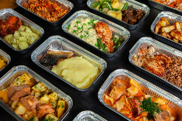 Business lunch in eco plastic container ready for delivery.Top view. Office Lunch boxes with food ready to go. Food takes away. Catering, brakfast.