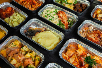 Business lunch in eco plastic container ready for delivery.Top view. Office Lunch boxes with food ready to go. Food takes away. Catering, brakfast.