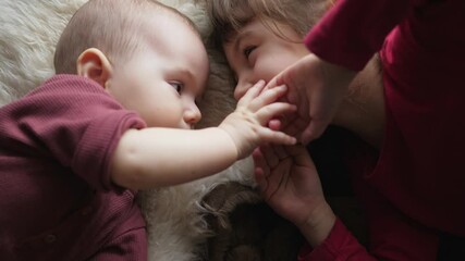siblings two sisters are playing a girl and a baby happy smiling - Powered by Adobe