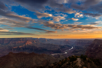 Fototapeta na wymiar Scenic view of the Grand Canyon and the Colorado River from the Desert View viewpoint, in the Grand Canyon National Park, at sunrise, in the State of Arizona, USA