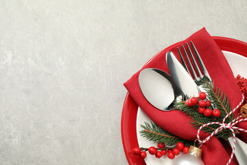 Beautiful Christmas table setting on light grey background, top view. Space for text