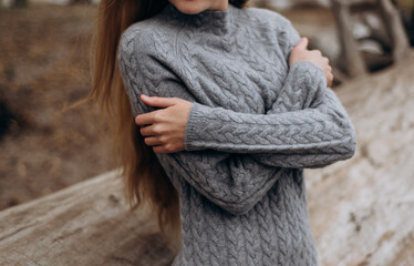 gray knitted cashmere sweater on a beautiful girl